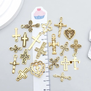 Collection of antique gold cross and heart charms for DIY jewelry making and necklaces