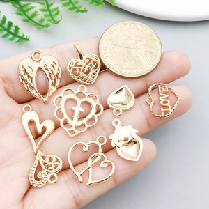 Set of 8 gold heart charms with angel wings and LOVE engraving for DIY jewelry making