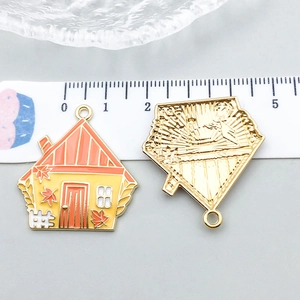 Macro view of a golden house pendant with autumn maple leaf design and ruler measurement