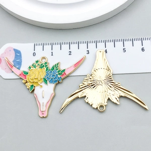 Detailed view of colorful oil-dripped bull head flower pendant with golden metal back