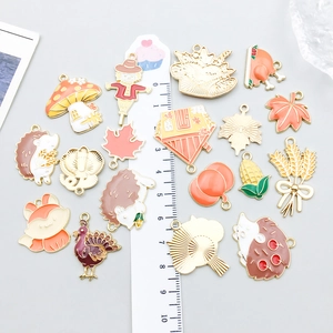 Colorful enamel Thanksgiving charms for DIY jewelry making featuring autumn harvest elements