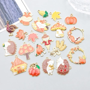 Macro shot of assorted colorful autumn charms like pumpkin and fox for DIY jewelry making