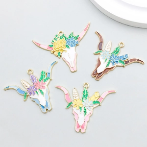 Detail of colorful enamel bull skull flower pendants for DIY jewelry and necklaces