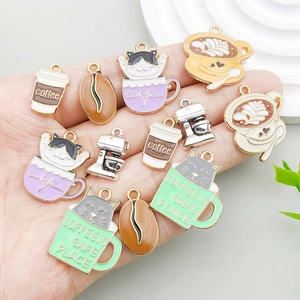 Set of assorted vintage enamel coffee cups and cat charms for DIY jewelry making