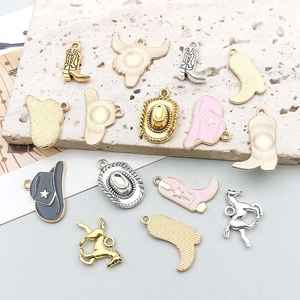 Detail of western cowboy charms featuring enamel boots, hats and horses for jewelry making