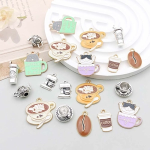 Detailed flat lay of assorted enamel cat and coffee themed alloy pendants for DIY jewelry