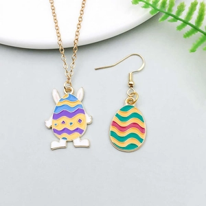Detail of Easter egg pendant necklace and earring with colorful enamel finish and bunny ears