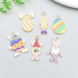 Detailed close-up of six colorful enamel Easter egg alloy charms for DIY jewelry making