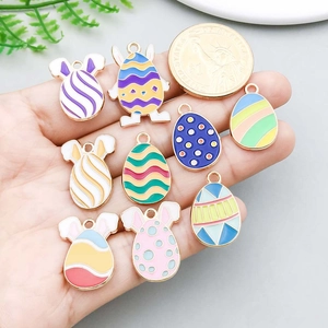 Easter egg and bunny alloy enamel charms with coin for scale reference
