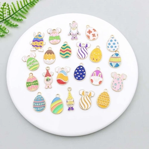 Detailed close-up of colorful enamel Easter egg pendants and cute gnome jewelry charms