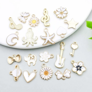 White enamel alloy charms set featuring butterfly starfish and daisy for DIY jewelry making