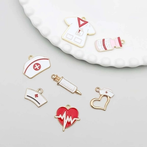 Detail view of medical alloy enamel charms featuring nurse hat and stethoscope for DIY jewelry