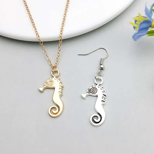 Detail view of gold and silver seahorse charms for DIY jewelry and earrings