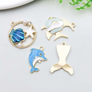 Detail showing sea animal charms with enamel finish and pearl accents for DIY jewelry