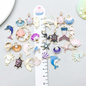 Mix of colorful ocean animal enamel charms with dolphins and sea turtles for DIY jewelry