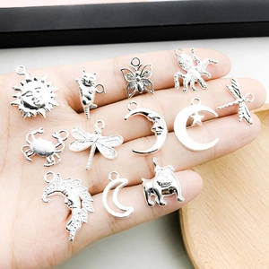 DIY silver alloy charm set featuring nature themes like sun, cat, butterfly and dragonfly