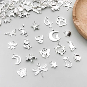 Detailed assortment of silver alloy charms featuring butterfly, moon, and animal designs