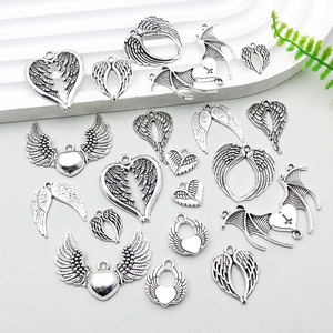 Detailed collection of vintage silver alloy heart and wing charms for DIY jewelry making