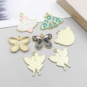 Detail of colorful enamel butterfly pendants with gold alloy bases for DIY jewelry