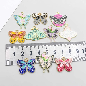 Colorful enamel butterfly and moth alloy pendants with ruler for size reference