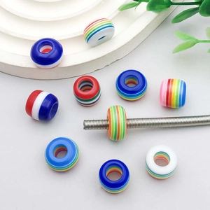 Colorful striped resin beads set for DIY jewelry making shown on white platform