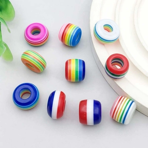 Colorful striped resin large hole beads for DIY jewelry making on white display stand
