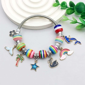 Detail of colorful striped resin beads and vibrant oil-drop alloy charms on bracelet