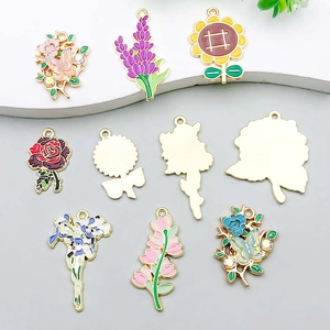 Detailed macro view of colorful enamel flower and butterfly charms with gold plating