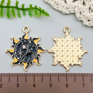 Detail of raven and crescent moon enamel pendant with size measurement in centimeters