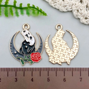 Macro shot of Ghostface moon pendant showing enamel front and textured gold back