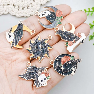 Gothic raven and moon enamel pendants for DIY jewelry making on white lace background