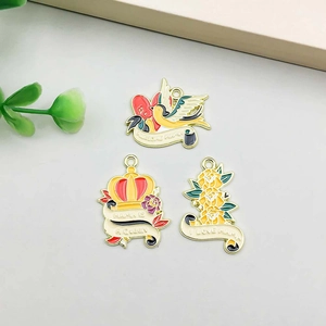 Detail of DIY enamel pendants with Mother's Day themes for necklaces and keychains
