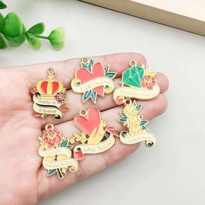 Golden alloy Mother's Day charms featuring enamel flower and heart shaped designs