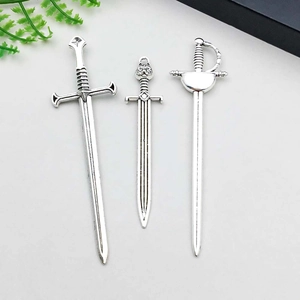 Three assorted silver alloy sword charms for DIY necklaces with vintage embossed patterns