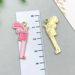 Pink enamel pistol pendants in alloy metal for DIY jewelry making and keychains