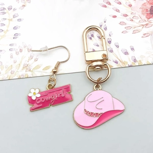 Pink Cowgirl themed jewelry set featuring an enamel cowboy hat keychain and earrings