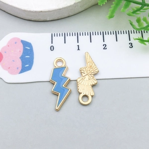 Close-up of colorful enamel lightning bolt charms showing front and back detail