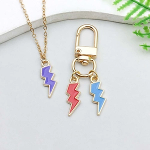 Detail of lightning bolt charms set including purple necklace and colorful keychains