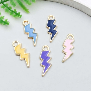 Detailed view of colorful enamel lightning bolt charms with gold edges for DIY jewelry