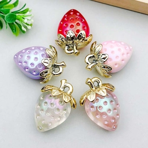 Five assorted colorful acrylic strawberry pendants with gold metal leaf caps for DIY jewelry