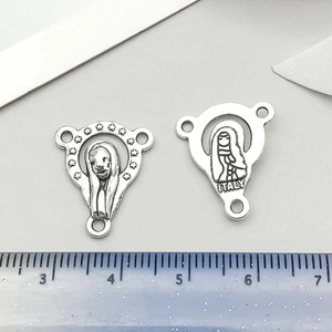Detailed view of silver Virgin Mary rosary centerpieces with front and back Italy engraving