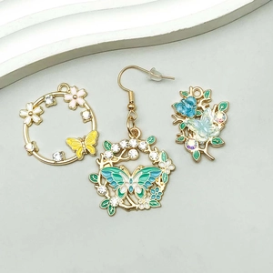 Macro detail of enamel butterfly floral pendant with sparkling colorful rhinestones