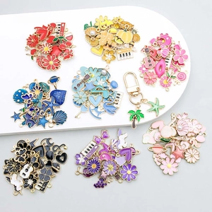 Detailed view of colorful enamel alloy charms in various shapes for DIY jewelry making