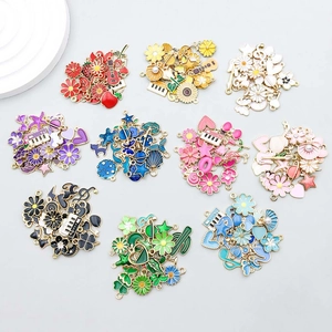 Detail of colorful enamel star and moon alloy charms for DIY necklace making