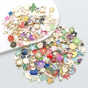 Macro view of colorful mixed enamel alloy star and moon charms for DIY jewelry making