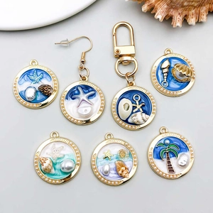 Pendentifs océan dorés avec émail bleu, coquillages et étoile de mer pour bijoux DIY