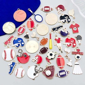 Detailed flat lay of colorful enamel sports charms including soccer and basketball designs