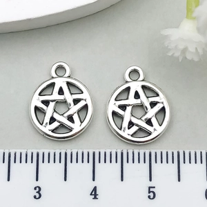 Macro detail of 20mm antique silver hollow pentagram star charms for jewelry making