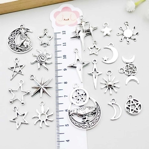 Assorted silver celestial charms including stars and moon for DIY jewelry making