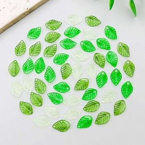 Mix of green acrylic leaf charms with detailed veins and holes for DIY jewelry making
